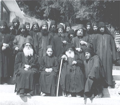 Elder Arsenios and the Fathers of New Skete. John Adondakis (Fr. Isaac) is shown on the bottom right.